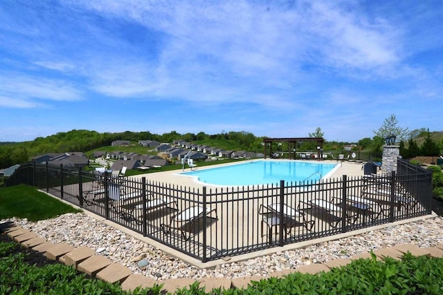 view of swimming pool featuring a patio area