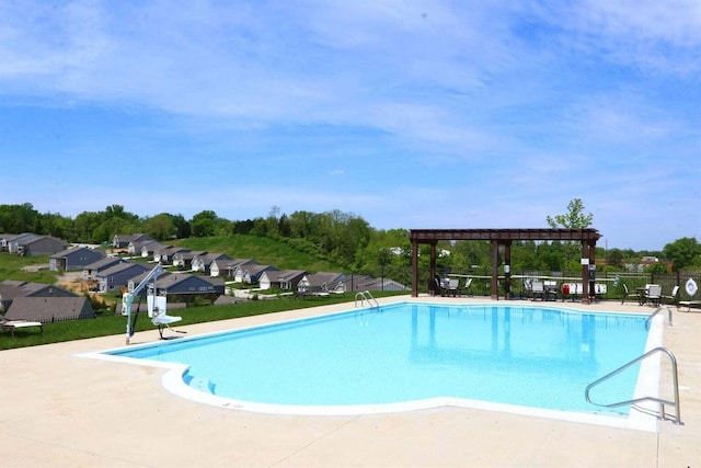 view of pool with a patio and a pergola