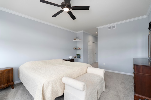 bedroom featuring a closet, light colored carpet, crown molding, and ceiling fan