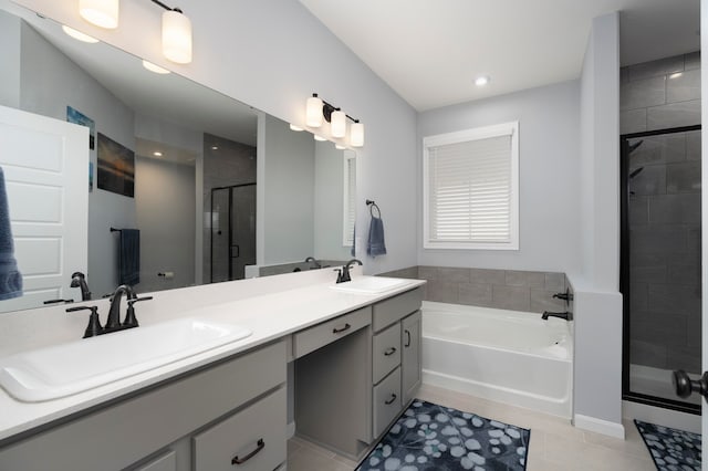 bathroom featuring vanity, plus walk in shower, and tile patterned flooring