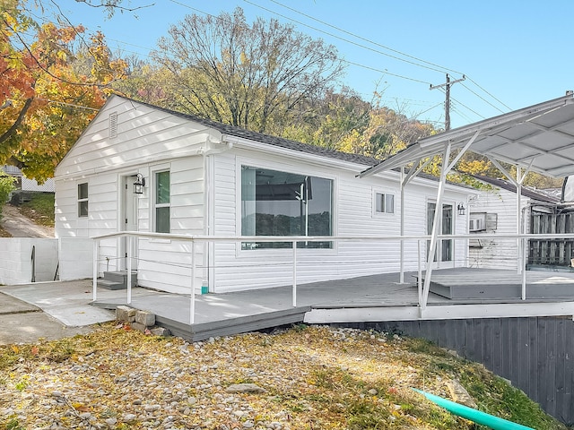 view of property exterior with a deck