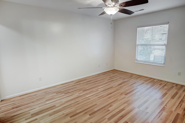 spare room with ceiling fan and light hardwood / wood-style floors