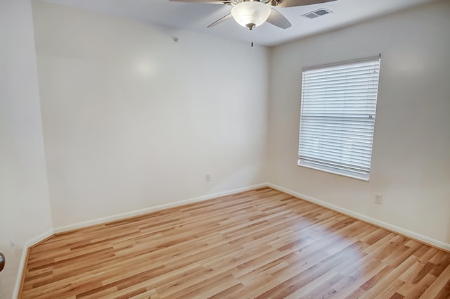 unfurnished room with ceiling fan and light wood-type flooring