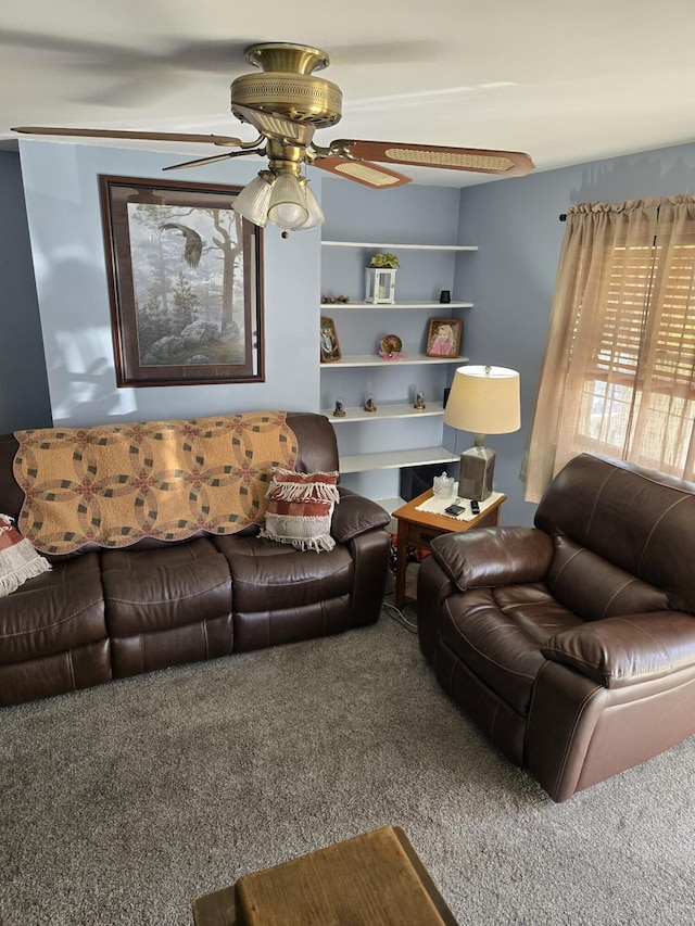 living room with ceiling fan and carpet floors