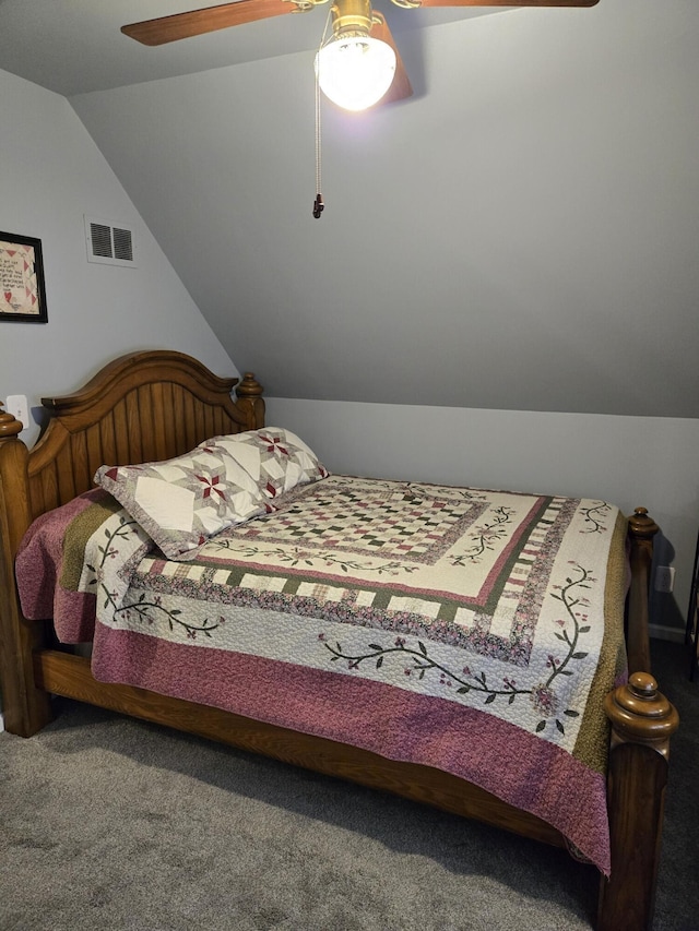 carpeted bedroom featuring ceiling fan and vaulted ceiling