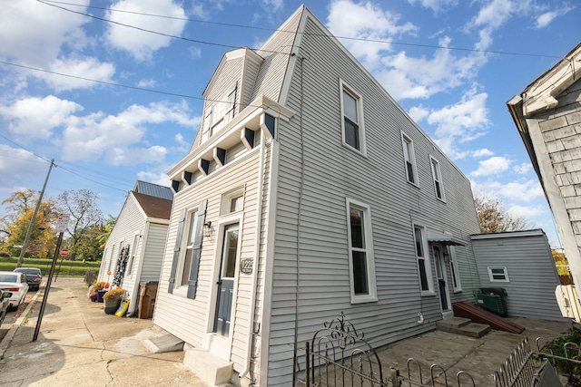 view of property exterior featuring a patio area