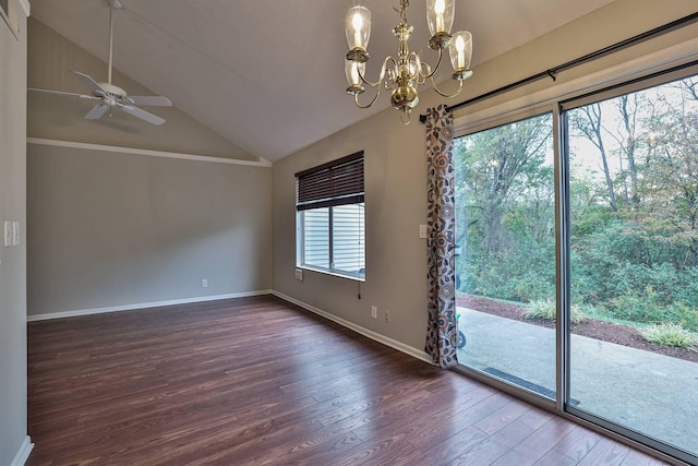 empty room with dark hardwood / wood-style floors, lofted ceiling, and ceiling fan with notable chandelier