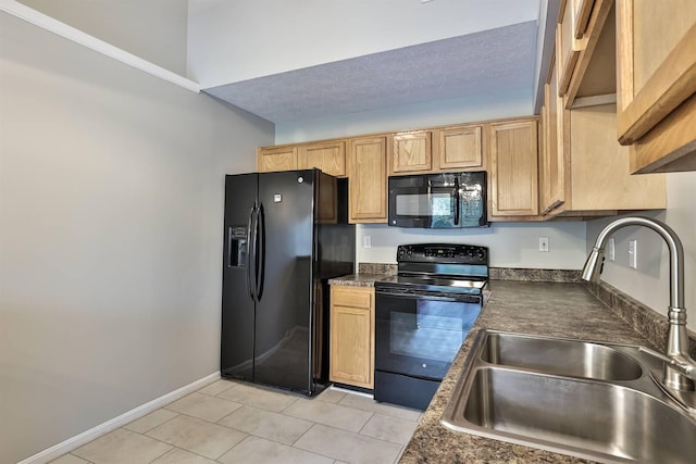 kitchen featuring sink, light tile patterned floors, a textured ceiling, and black appliances