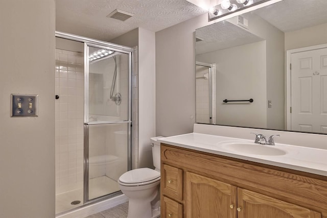 bathroom with toilet, walk in shower, a textured ceiling, and vanity