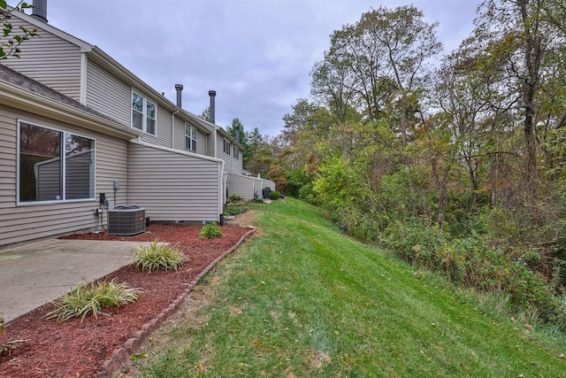 view of yard featuring a patio and cooling unit