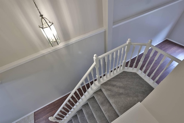 stairs with wood-type flooring