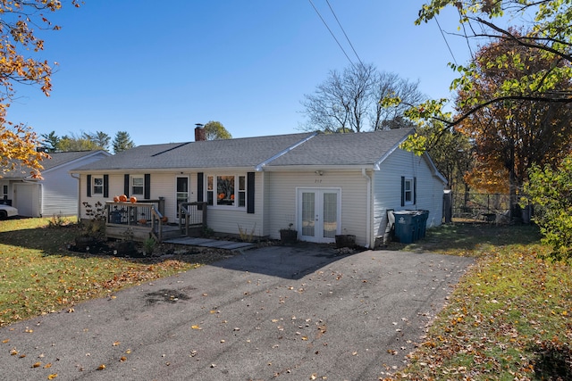 single story home with french doors and a deck