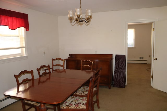 dining area with a notable chandelier, carpet floors, and a baseboard radiator