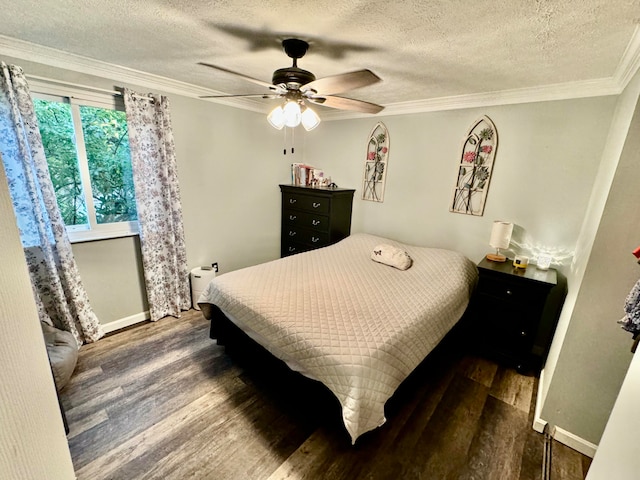 bedroom featuring a textured ceiling, crown molding, ceiling fan, and dark wood-type flooring