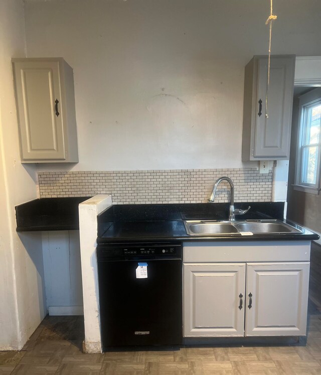 kitchen with dishwasher, decorative backsplash, sink, and light parquet floors