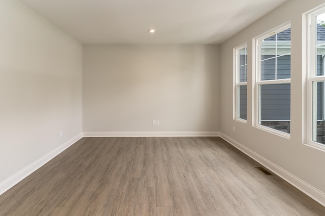 spare room with light wood-type flooring