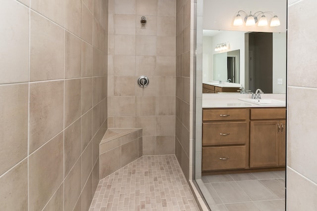 bathroom featuring vanity and a tile shower