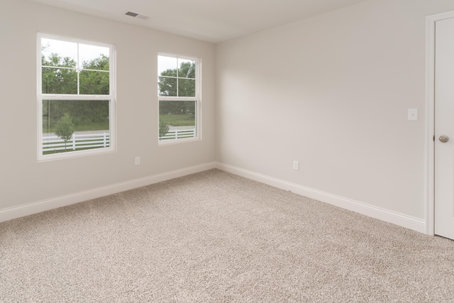 empty room featuring carpet floors