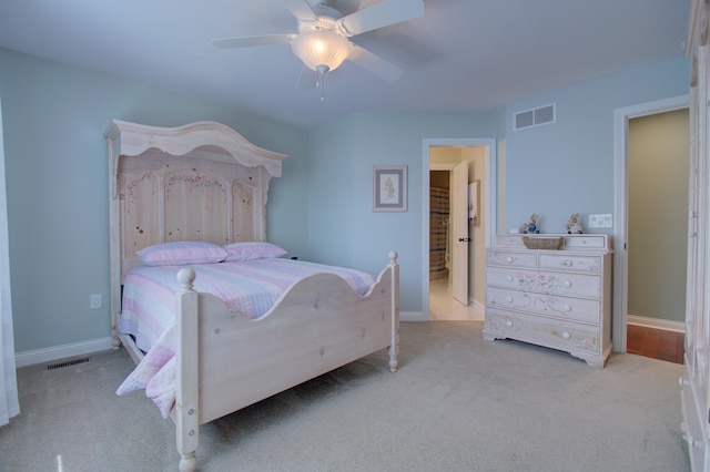 bedroom featuring light carpet and ceiling fan