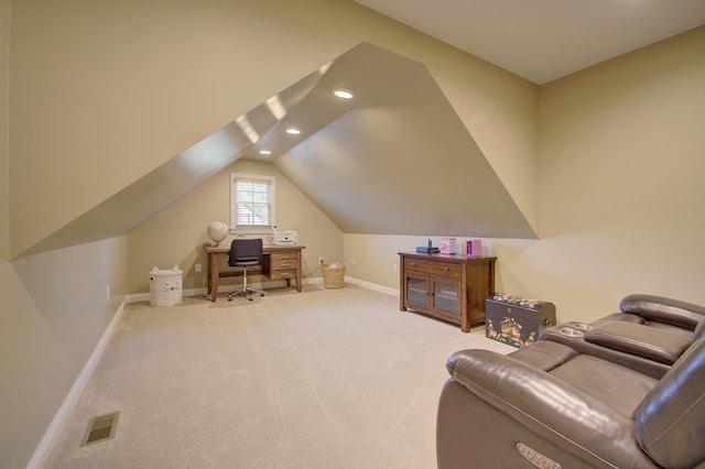 home office featuring carpet flooring and vaulted ceiling