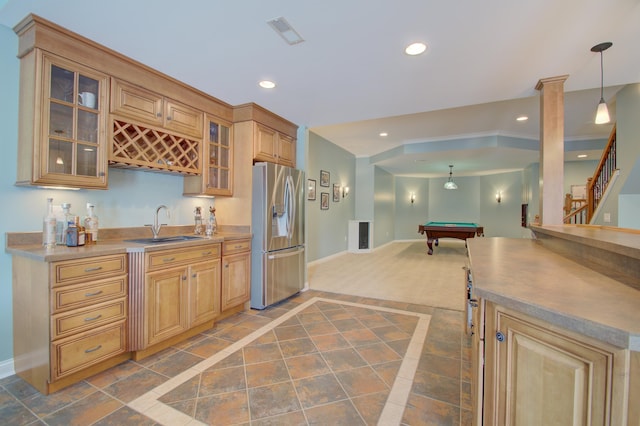 kitchen featuring hanging light fixtures, billiards, sink, and stainless steel refrigerator with ice dispenser