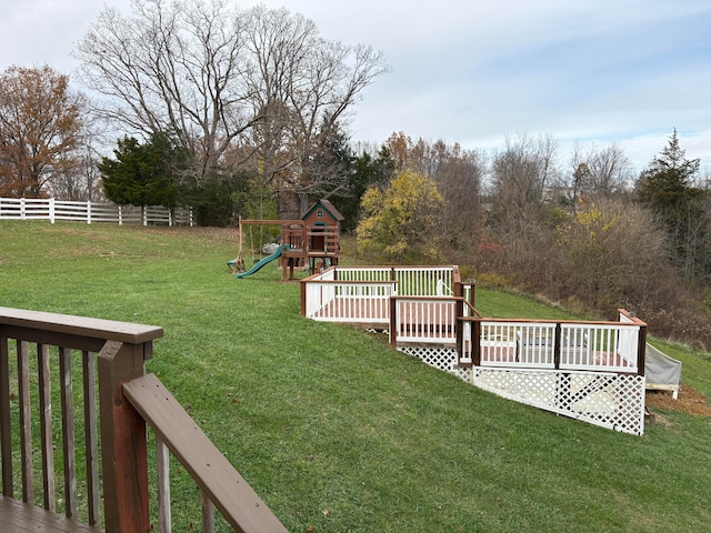 view of yard with a playground and a wooden deck