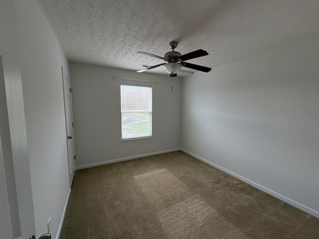 unfurnished room featuring ceiling fan, a textured ceiling, and carpet floors