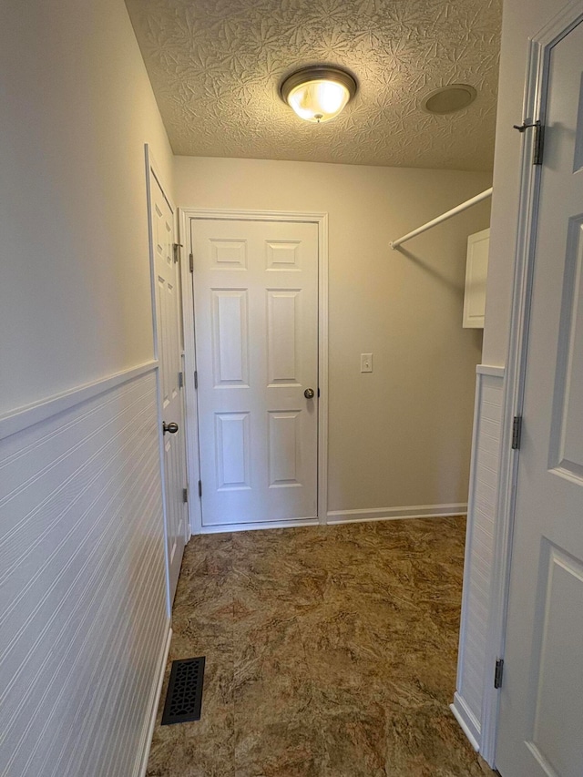 interior space with a textured ceiling