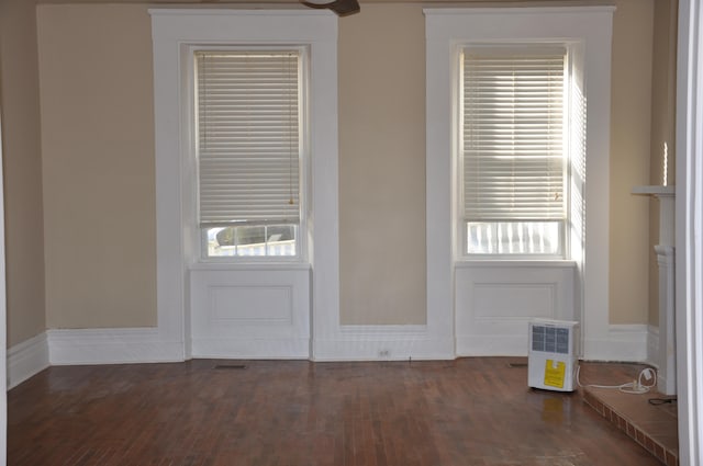 doorway to outside featuring dark wood-type flooring