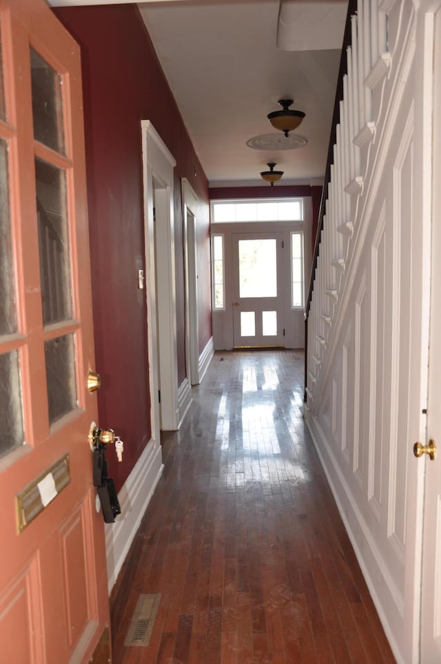 doorway to outside featuring dark hardwood / wood-style flooring