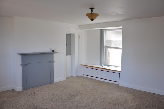 unfurnished room with light carpet