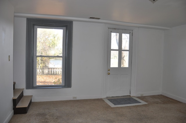 doorway featuring carpet