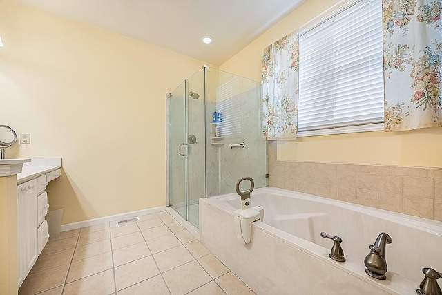 bathroom featuring vanity, tile patterned floors, and shower with separate bathtub