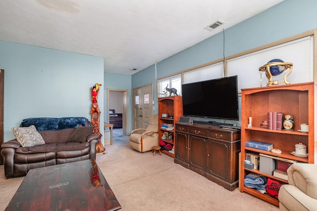 living room featuring light colored carpet