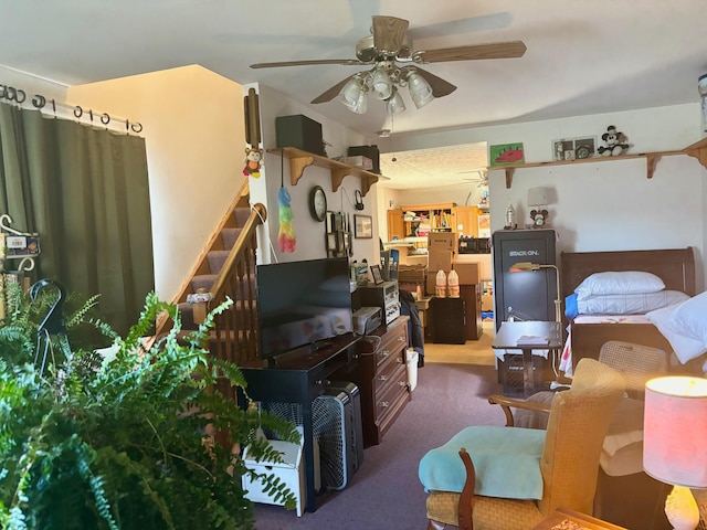 misc room featuring ceiling fan and carpet