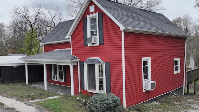 view of home's exterior with cooling unit