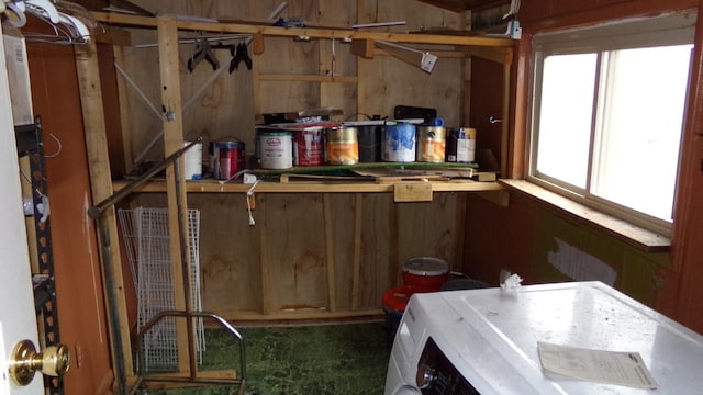 laundry room with washer / clothes dryer and wooden walls