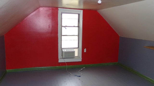 bonus room featuring hardwood / wood-style flooring, cooling unit, and vaulted ceiling