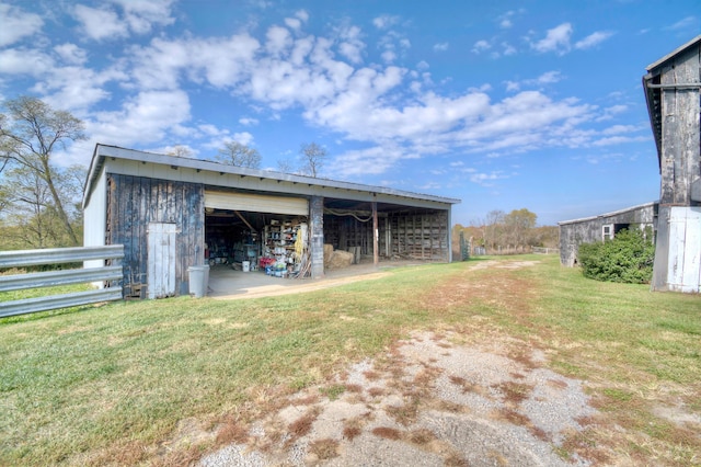 view of outbuilding with a lawn