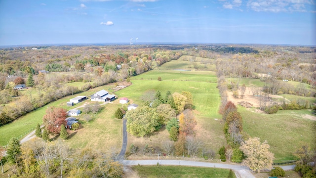 birds eye view of property with a rural view