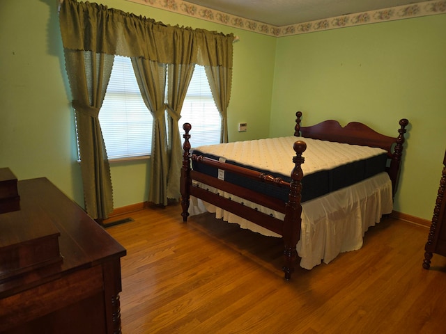 bedroom featuring wood-type flooring