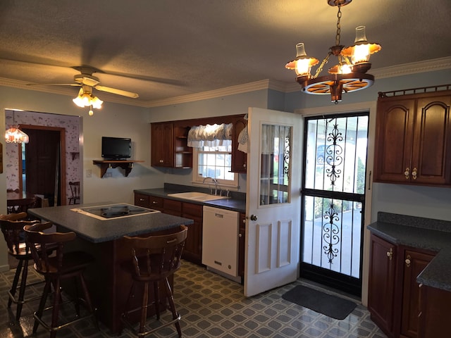 kitchen with a kitchen breakfast bar, ornamental molding, sink, white dishwasher, and cooktop