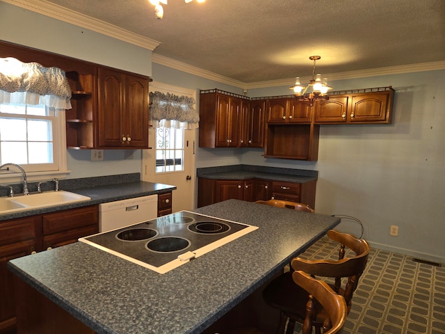 kitchen with a center island, sink, an inviting chandelier, crown molding, and white dishwasher