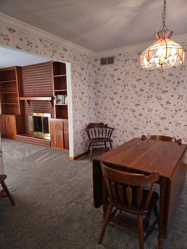 unfurnished dining area featuring carpet, a brick fireplace, and crown molding