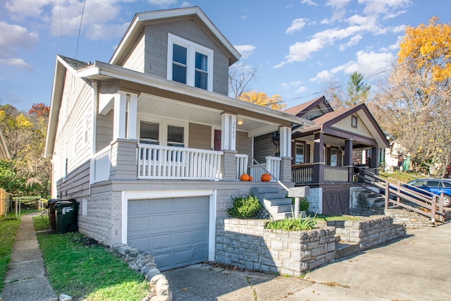 view of front facade featuring covered porch and a garage