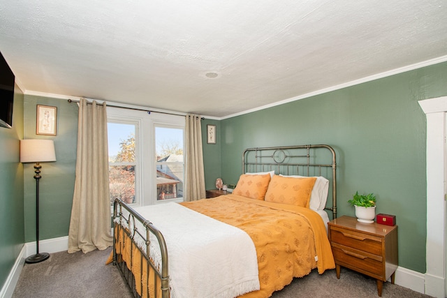 bedroom with carpet floors, a textured ceiling, and ornamental molding