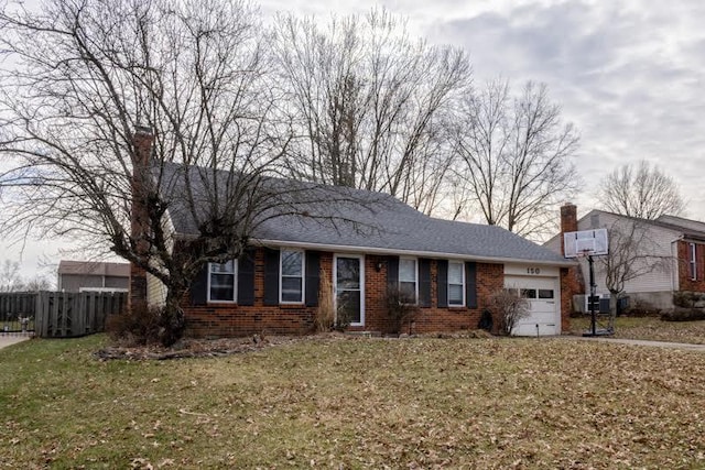 ranch-style house with brick siding, a chimney, an attached garage, fence, and a front yard