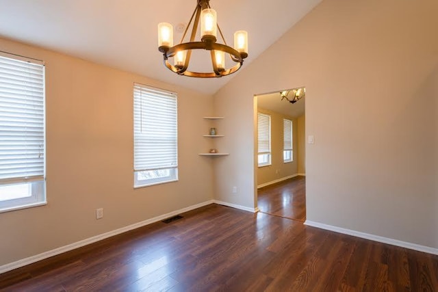 unfurnished room with lofted ceiling, visible vents, dark wood-type flooring, a chandelier, and baseboards