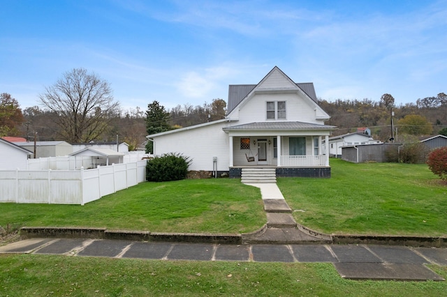 view of front facade with a front yard and a porch