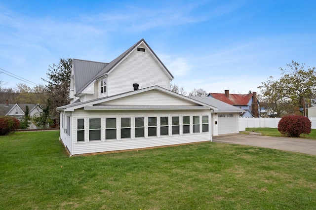 view of side of property with a lawn